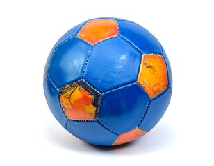 Fototapeta premium Aged blue and orange soccer ball, showing wear and tear, sport equipment