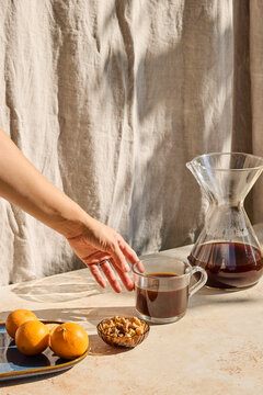 Coffee in a glass with snacks around 