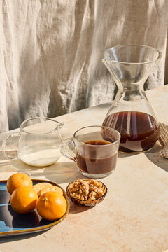 Coffee in a glass with snacks around 