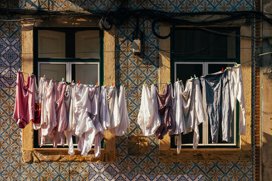 Laundry drying against traditional Lisbon azulejos