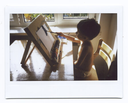 Todder Draws While Sitting At The Table