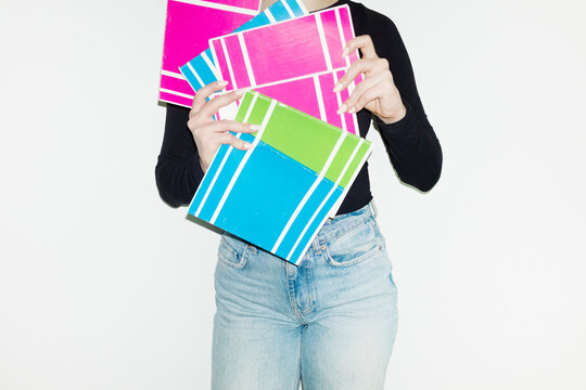 Person holding classic school education notebooks in work office 