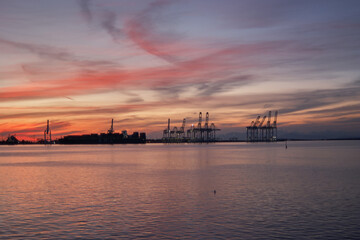 Sunset and Crescent Moon Over Victoria Harbour with Distant Dock