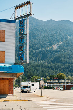 Vintage motel sign and RV on street corner