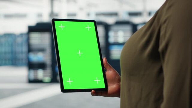 Server room admin uses isolated screen tablet to increase supercomputers workload capacity. Data center worker configures gear with chroma key device notebook, improving processing speed, camera B - Powered by Adobe