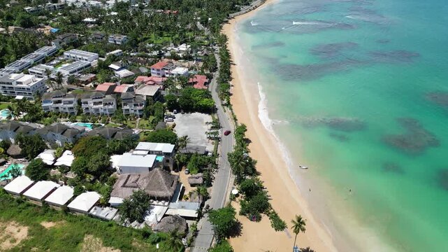 Aerial view of Punta Popy Beach &mdash; beach and turquoise water with tropical green palms. Great for nature documentaries.
