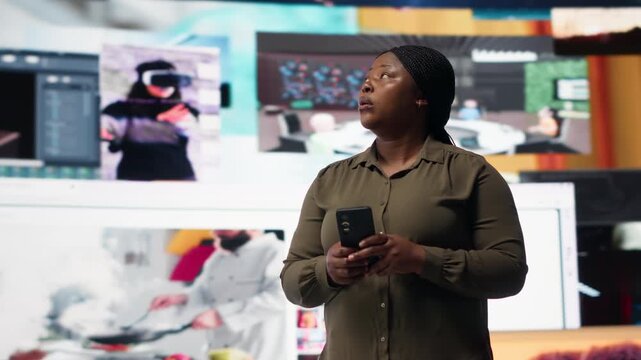 Woman using smartphone surrounded by curated video recommendations while browsing streaming services. Person enjoying free time browsing favorite online clips on phone, camera B