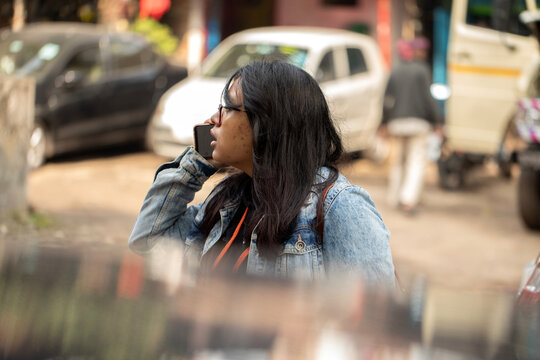 Service woman booking rides via smartphone