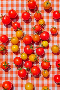 Cherry tomatoes on a checkered tablecloth