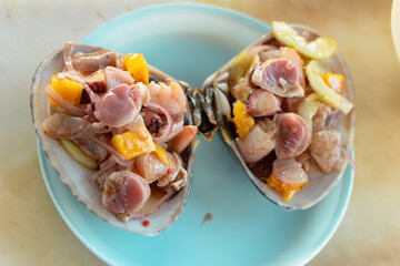 Clam prepared on the shell 
