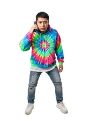 Fototapeta premium Confused young man holds a TV remote to his ear like a phone, expressing bewilderment. Humorous tech misunderstanding for lifestyle or advertising.