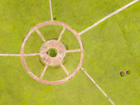 Aerial View of Circular Park with Red Paths