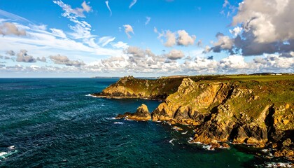 Fototapeta premium Coastal cliffs meet the ocean under a dramatic sky
