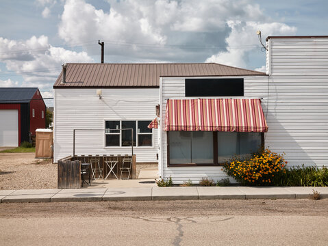 Small White Storefront with Striped Awning in Elbow Saskatchewan