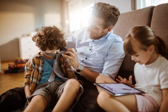 Father and Children Playing at Home