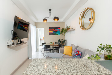 Modern living room with colorful decor and cozy sofa