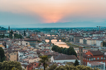 Shot of Ponte Vecchio, Florence, Firenze, Tuscany, Italy at golden hour sunset