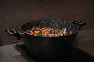 Stew cooking with meat and vegetables in a pot