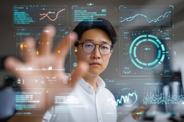 Asian male engaging with futuristic virtual touchscreen interface in high-tech environment