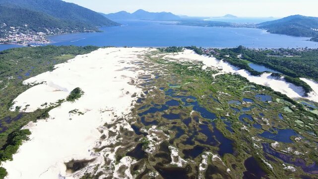 Aerial view of the Municipal Natural Park of the Dunes of Lagoa da Concei&ccedil;&atilde;o and Joaquina Beach, a conservation unit in Florian&oacute;polis, Santa Catarina. Dune fields, restinga vegetation