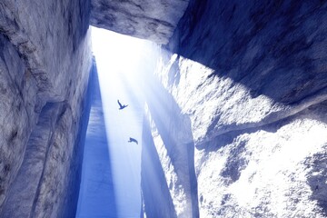 Sunlight streams through a rocky canyon, birds fly high