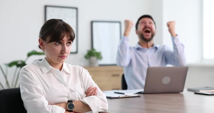 Woman feeling jealous of her colleague's success in office