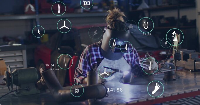 Welding female welder wearing helmet leaning on workbench, casting torch arc with digital overlays