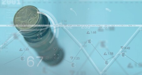 Displaying one-euro coin stack on blue desk with financial chart overlays, copy space