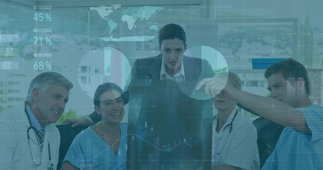 Analyzing patient data overlays on monitor, staff in coats and scrubs in hospital meeting room