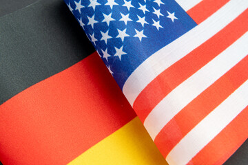 A close up of the German national flag together with the USA flag. A Germany, USA relations concept.