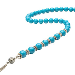 Obraz premium Bright turquoise prayer beads with silver metal spacers and tassel rosary tasbih