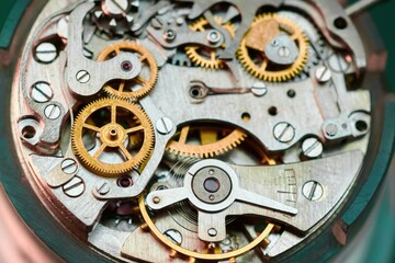 Wristwatch mechanism revealed through macro photography showcasing intricate gears and craftsmanship in elegant detail
