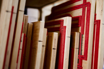 Creative design processes unfold in a cardboard box manufacturing workshop showcasing intricate die...