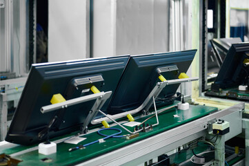 Television manufacturing process in a production plant with multiple units moving along the conveyor system