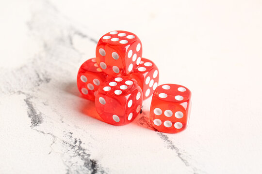 Red dices on light background