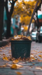 Bucket filled with autumn leaves on a sidewalk