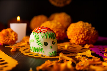 Sugar skull with Candles, Cempasuchil flowers or Marigold and Papel Picado. Decoration...