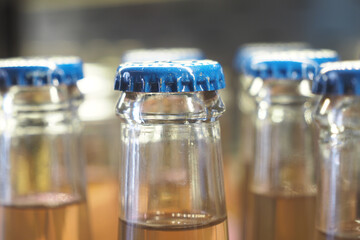 Brightly colored capped bottles arranged on a counter