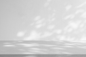 close up mockup studio with shadowing and light of white plain concrete wall texture and tabletop for show product on display background concept