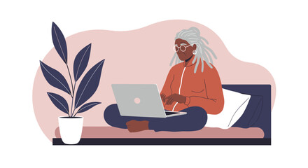 Man working remotely on a laptop at a home office desk, surrounded by minimalist decor. Concept of productivity, freelance, or online education.
