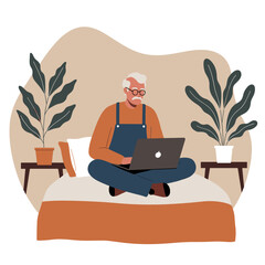 Senior Black woman focused on her laptop at a modern cafe table, symbolizing productivity, remote work, and an active digital lifestyle.