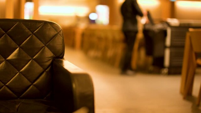 Cleaning Staff Working in Airport Lounge with Leather Armchair
