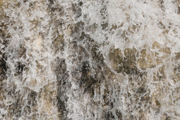 Abstract textured background of a clear waterfall. Waterfall in the mountains of a tropical forest. Ecological and environmental concept. For graphic design, 3D rendering and web banners