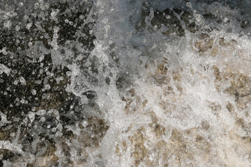 Abstract textured background of a clear waterfall. Waterfall in the mountains of a tropical forest. Ecological and environmental concept. For graphic design, 3D rendering and web banners
