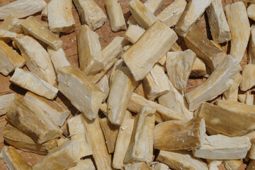 Close up of pieces of cassava that are dried in the sun, called gaplek. The concept of traditional Indonesian food. For graphic design, 3D rendering and banners