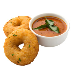 Two golden fried ring shaped vadas with bowl of sambar and curry leaves indian food fried food