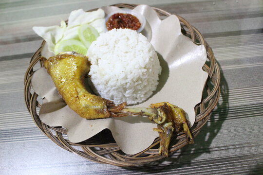 plate of rice with chicken and vegetables