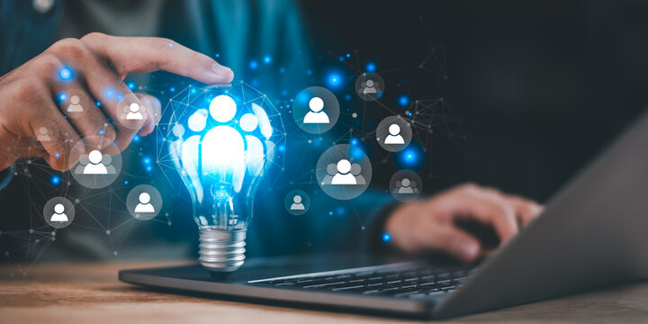 Creative idea concept with glowing light bulb and people icons connected by digital network, symbolizing innovation, teamwork, human resources, social connection, technology, and business solutions.