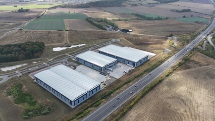 Aerial drone wide angle shots of new build warehouses, distribution centres and factories, loading...