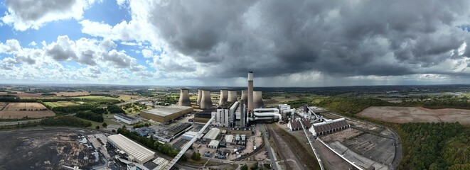 Aerial drone view of power plant station, electrical energy generation coal gas and oil, moody...